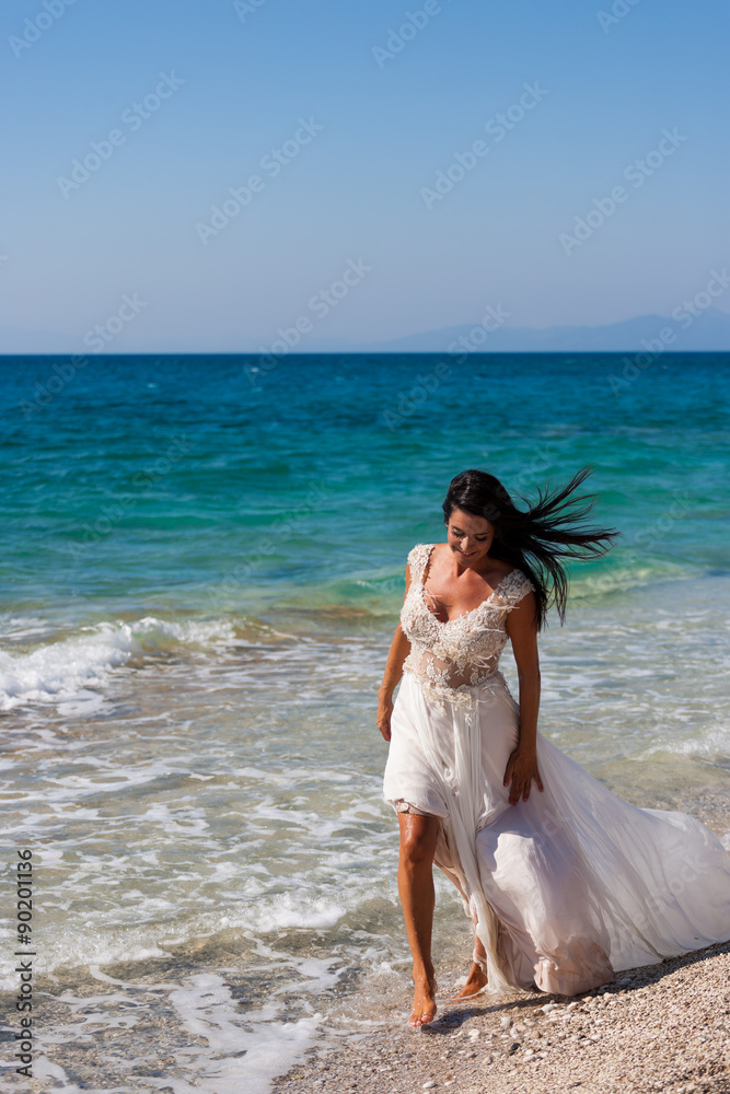 bride in her snow-white dress on the beach bride in her snow-white dress on the beach