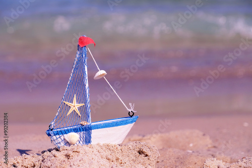 Toy ship on sea background