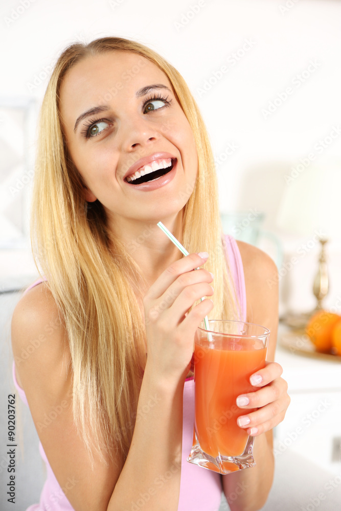 Young beautiful woman drinking fresh juice Young beautiful woman drinking fresh juice