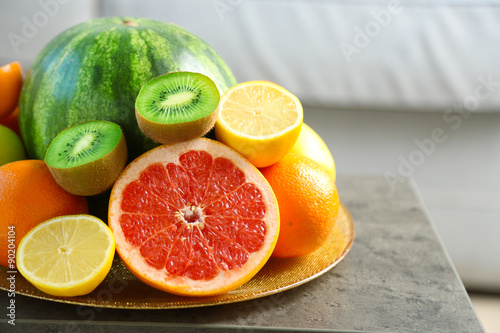 Fresh fruits on table in living room  close up