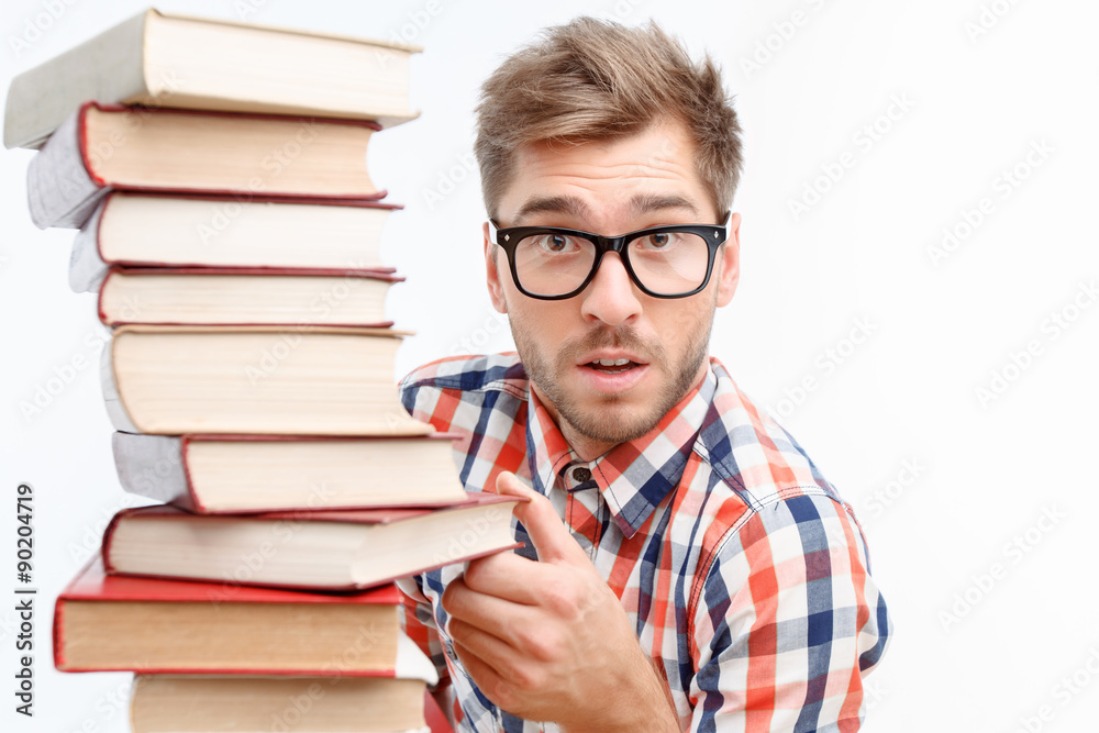 Young student holding books. Young student holding books.