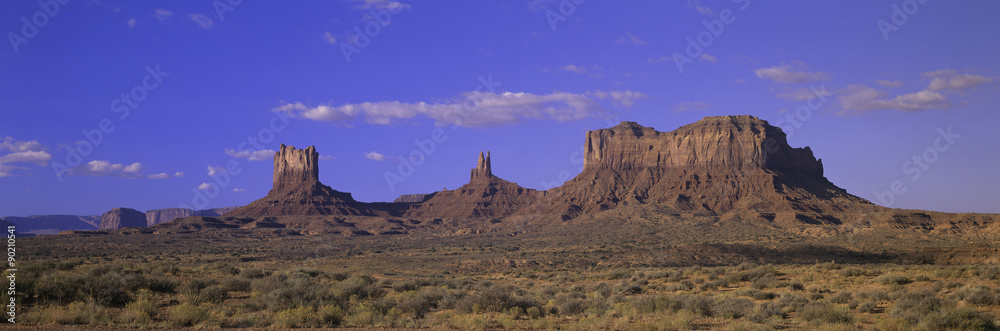 Panoramic view of red buttes and colorful spires of Monument Valley Navajo Tribal Park, Southern Utah near Arizona border