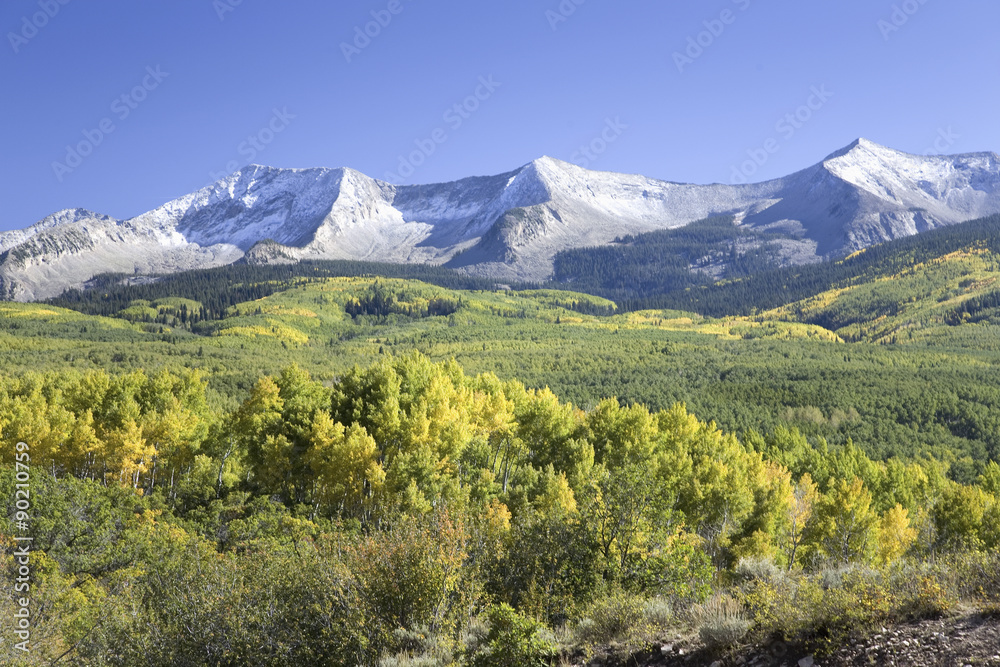 Fototapeta premium Snow capped mountains with autumn color off Route 62 west of Ridgeway toward Telluride, Colorado