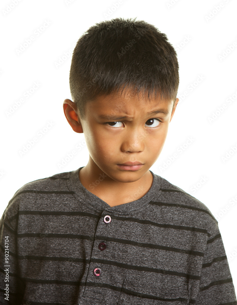 Cute Filipino Boy with Skeptical Expression on White Background Cute Filipino Boy with Skeptical Expression on White Background