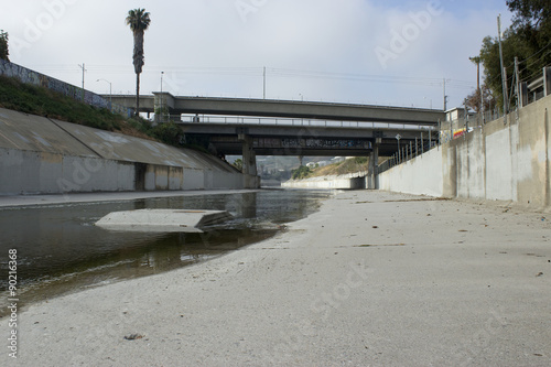 Concrete  Creek Water Flow with Palm Trees and Street Art