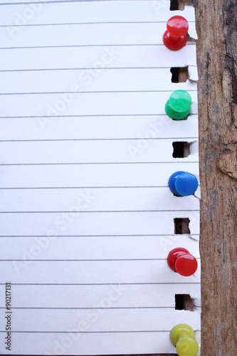 Paper notes with colorful push pins