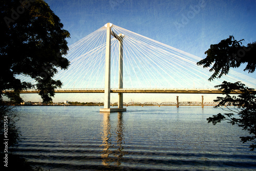 Fotografie aged and worn vintage photo of cable bridge over Columbia river
