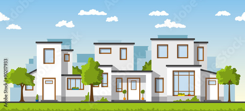 Three modern white houses in a suburb