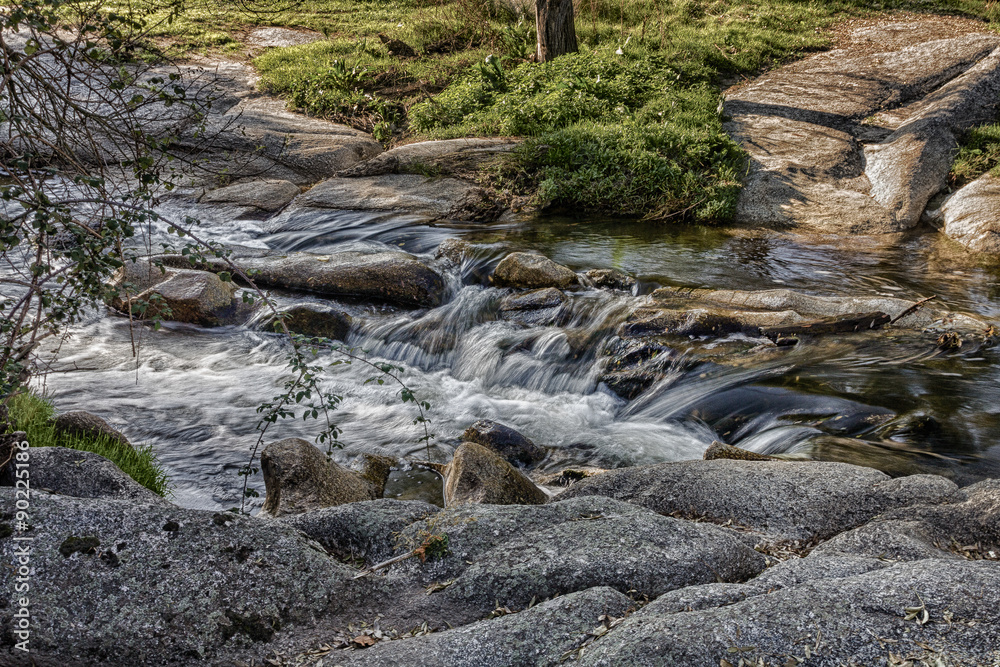 silky waterfall on a small river at sunset silky waterfall on a small river at sunset