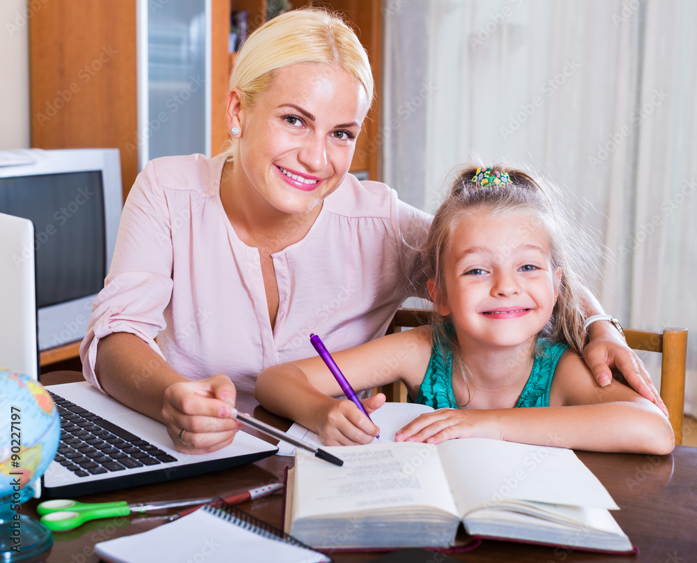 Fototapeta premium Woman and child having lesson