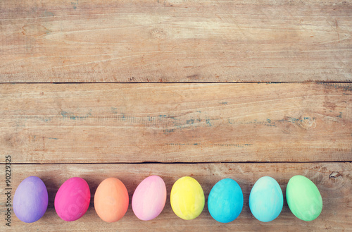 Vintage colorful easter eggs on wood table background