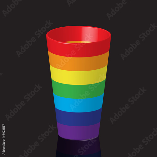 Colorful rainbow plastic cup with reflection, on dark background