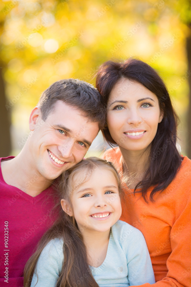 Happy family in autumn park Happy family in autumn park