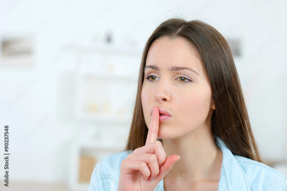 Woman gesturing us to be quiet