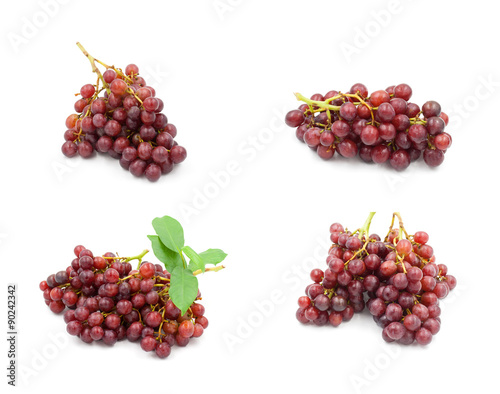 Red seedless grapes on a white background.