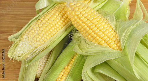 corn on cob on wood background