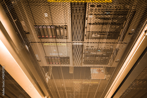 computer server in rack with gold light close up