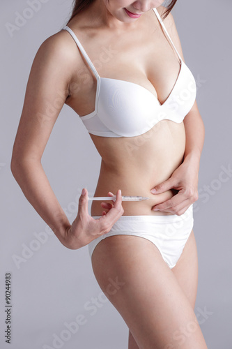woman inject drugs on waist photo