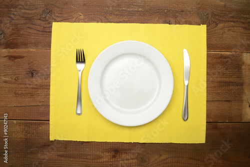 Table setting on wooden rustic dinning table for one person
