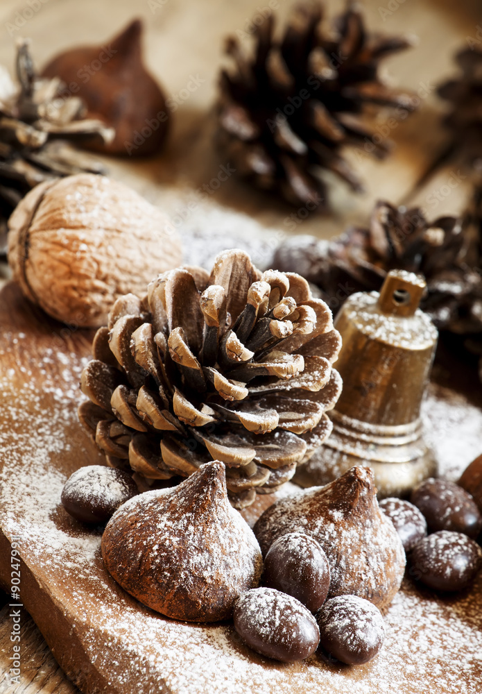 Christmas and New Year composition with fir cones, nuts, chocola