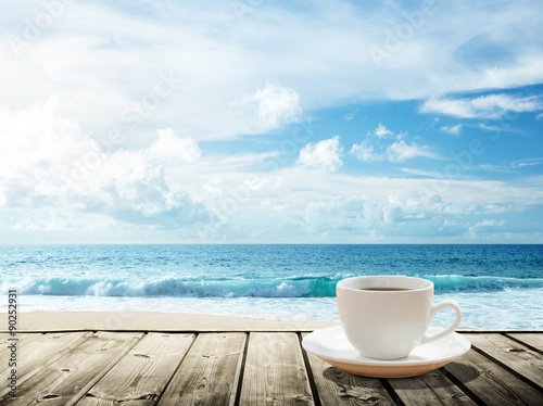 sea and cup of coffee