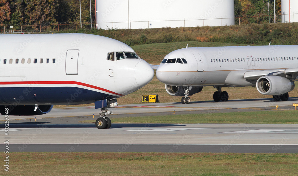 Two Commercial Jets Await Clearance to Take Off Two Commercial Jets Await Clearance to Take Off
