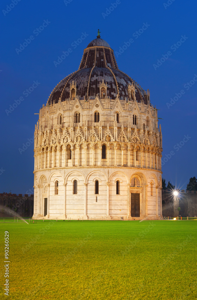Baptistery at night on Piazza dei Miracoli in Pisa, Italy.