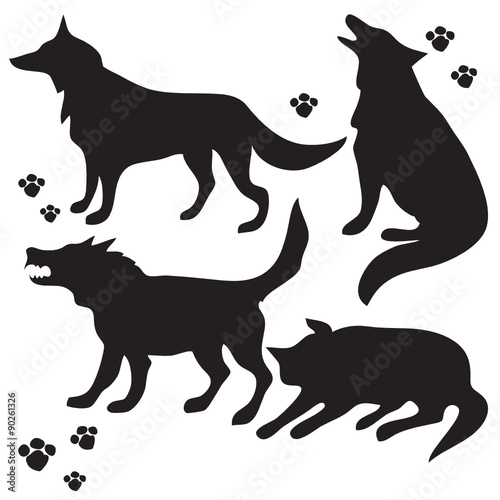 Hand drawn sketch set of wolves silhouettes on white background.