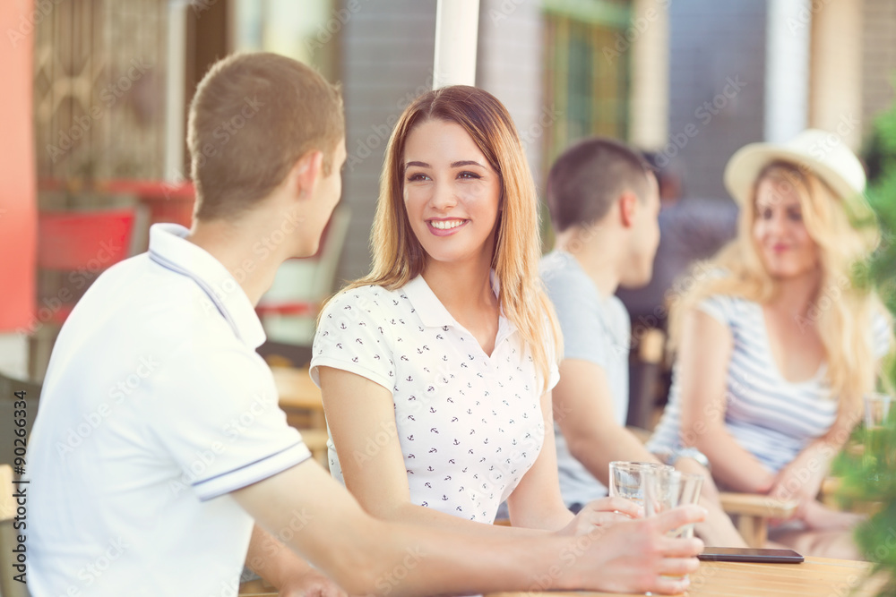 Happy young couple sitting in a cafe Happy young couple sitting in a cafe