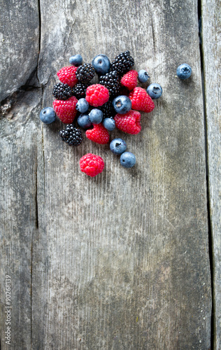 summer berries on wooden surface