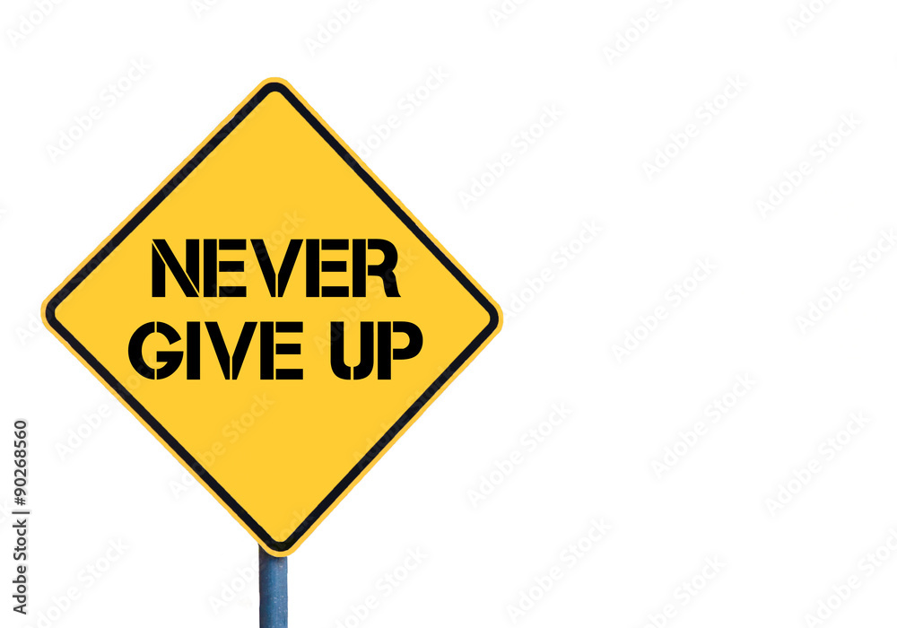 Yellow roadsign with Never Give Up message Yellow roadsign with Never Give Up message