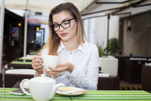 Young elegant girl in restaurant.