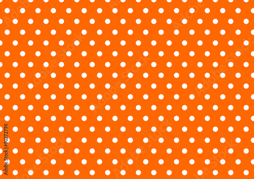 white polka dot on orange background