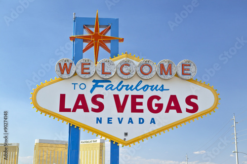 Colorful sign reads ÒWelcome to Fabulous Las Vegas, NevadaÓ in daytime with blue sky