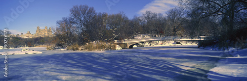 Panoramic view of bridge over frozen pond in Central Park, Manhattan, NY on upper west side near Central Park West