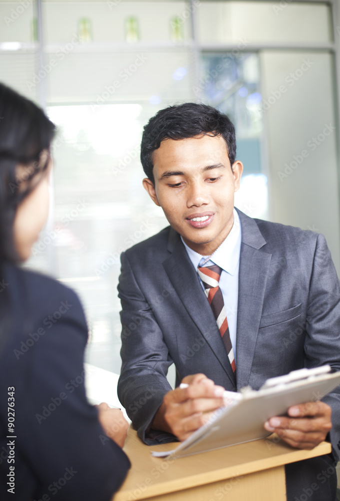 Images of business men and women discussion work an office Images of business men and women discussion work an office