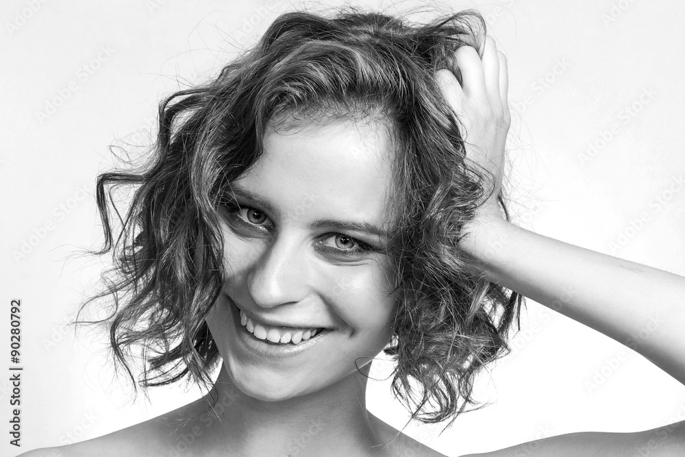 Fototapeta premium Smiling beautiful girl closeup portrait black and white