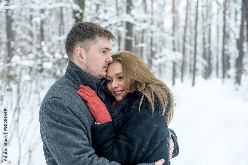 Portrait of happy couple in winter park Portrait of happy couple in winter park