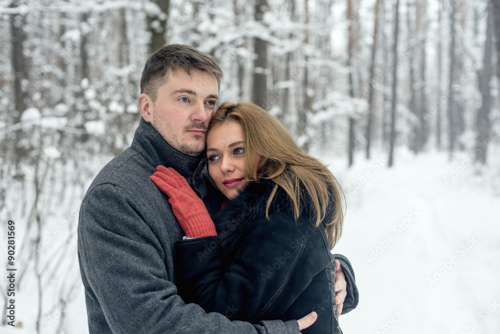 Portrait of happy couple in winter park Portrait of happy couple in winter park