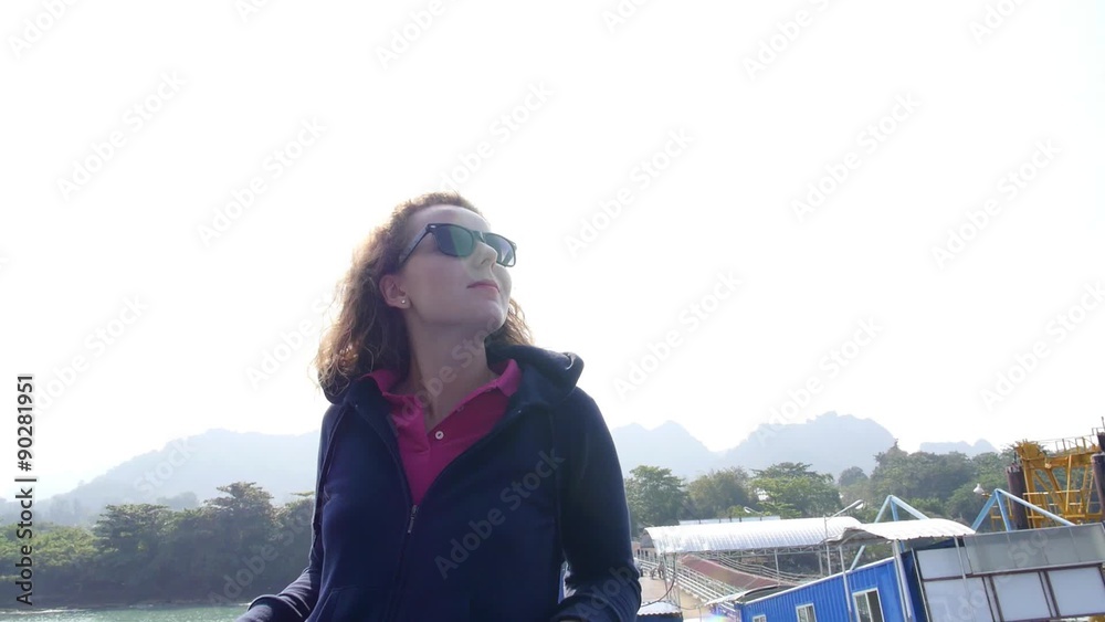 Beautiful Girl Relaxing on Deck in Sunny Day. Slow Motion. Beautiful Girl Relaxing on Deck in Sunny Day. Slow Motion.