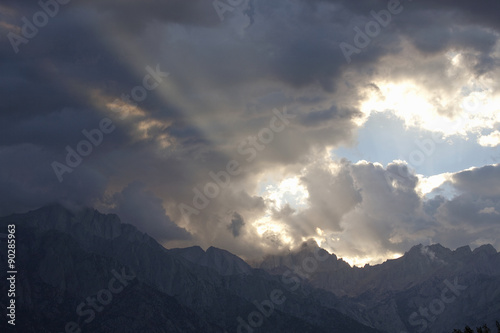 "God Sun Rays"" at sunset are seen on the Eastern slope of the Sierra Nevada Mountains, along Route 395, CA.