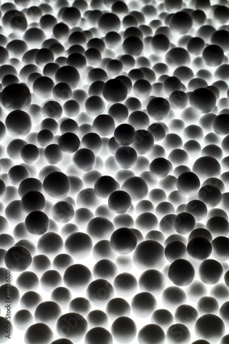 Silhouette of foam balls on the light.Create for background texture.