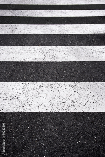Asphalt road top view with a white line