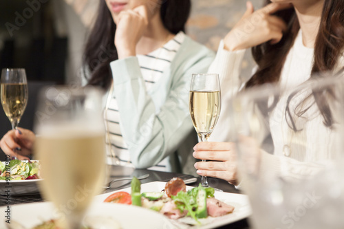Women have a meal while drinking champagne