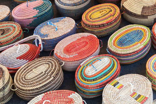 Colorful African wicker baskets in a row