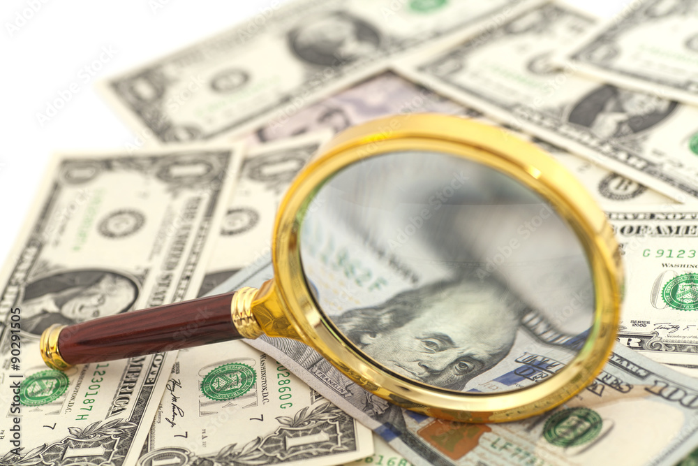 dollar banknotes under magnifying glass isolated dollar banknotes under magnifying glass isolated