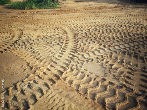 Wheel tracks on the soil.