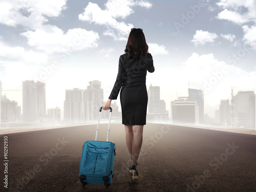 Fotografie Business woman walking alone on the street