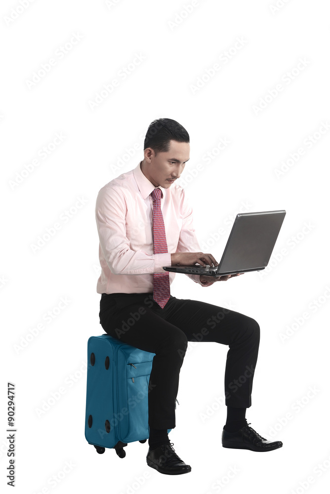 Man Working With Laptop Sitting On Suitcase Man Working With Laptop Sitting On Suitcase