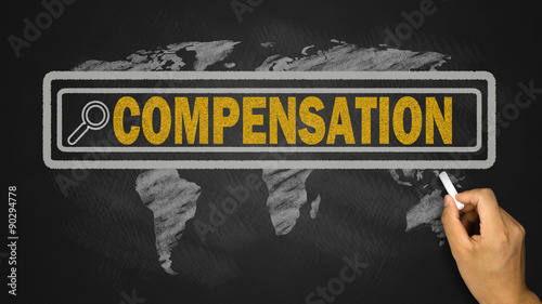 search for compensation concept on blackboard photo